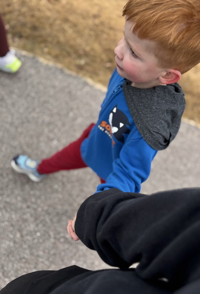 student holding hands at running club 