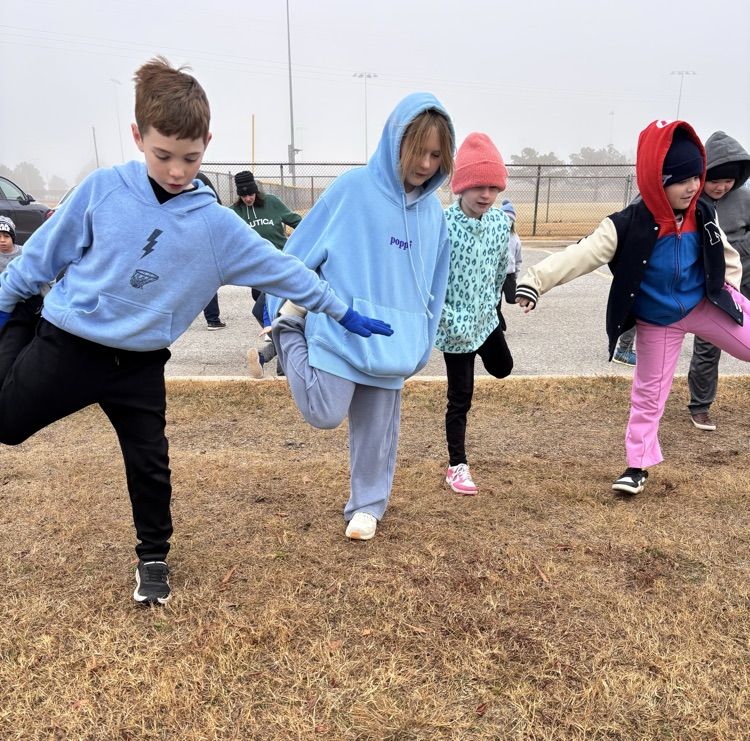 students stretching at running club 