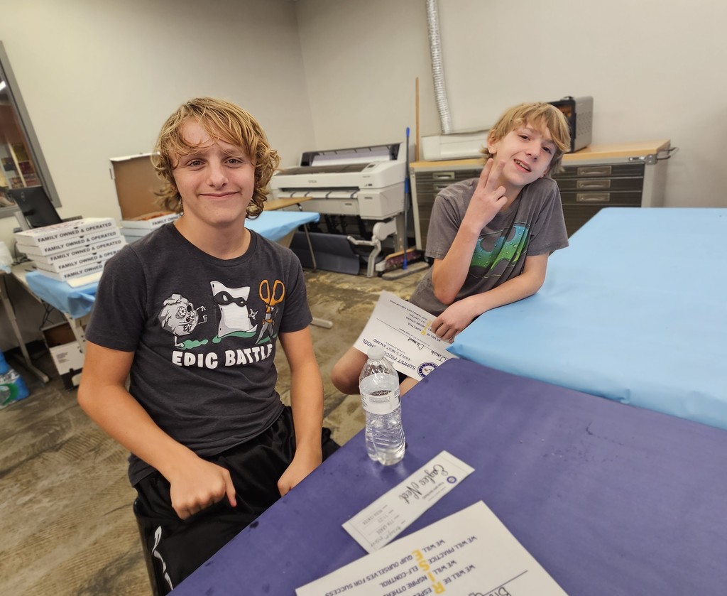 Students smile for camera during Eagles Nest luncheon.