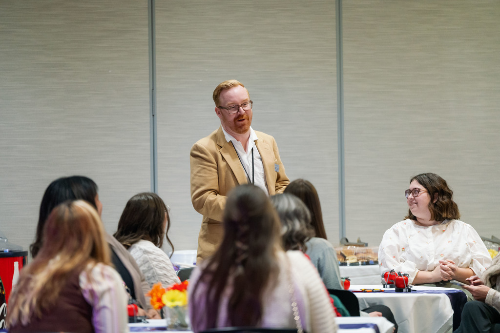 man standing up at a table