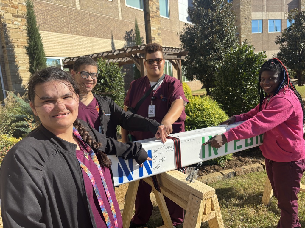 Interns pointing to where we made our mark on Integris Health Edmond.