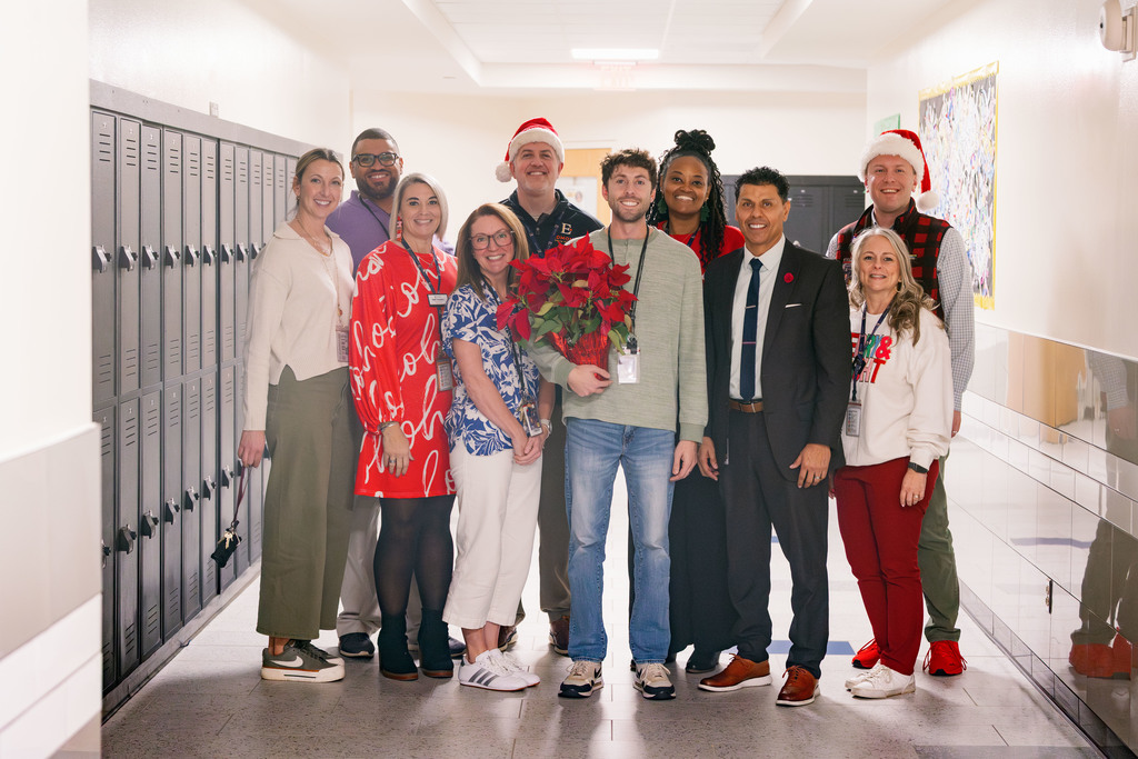 Summit Teacher of the Year, Daniel DeWindt, is pictured with district administrative personnel after being announced as one of six finalists for District Teacher of the Year. 