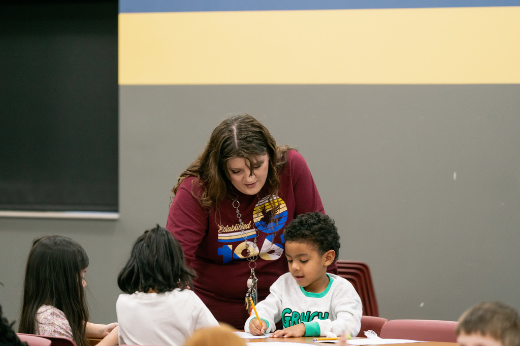 woman helping a student