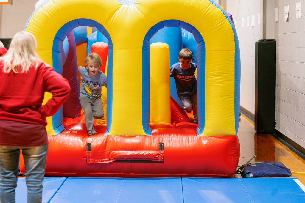 students in an inflatable