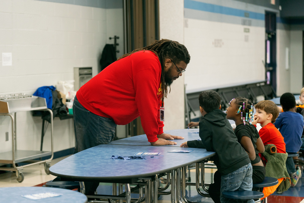 man helping students