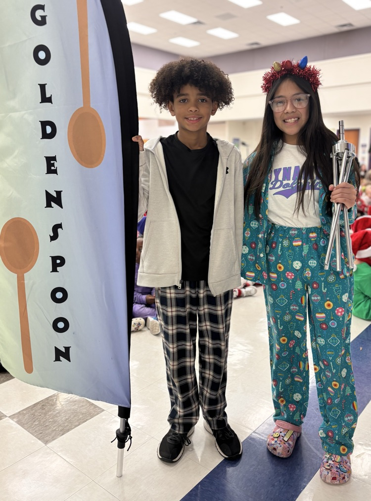 students with golden spoon flag  