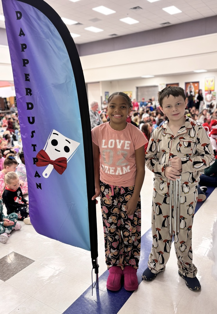 students with dapper dustpan flag
