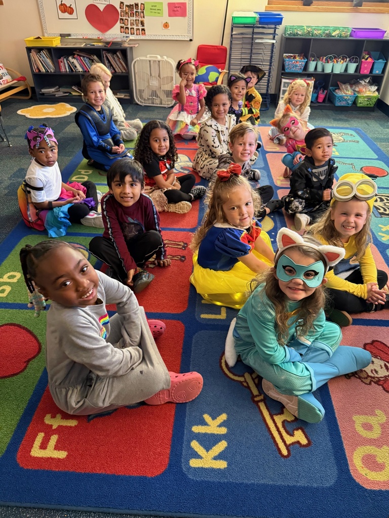 Students on classroom rug ready to learn