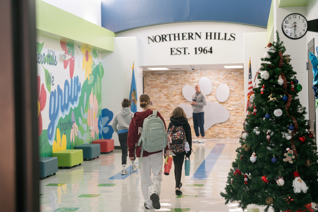 students walking into school