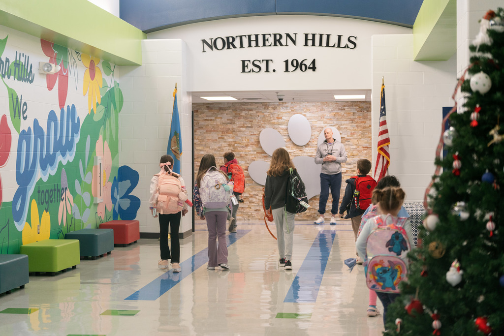 students walking into school