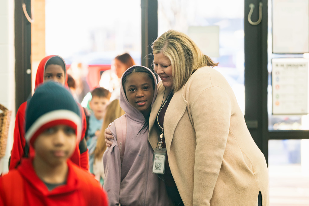 principal hugging student