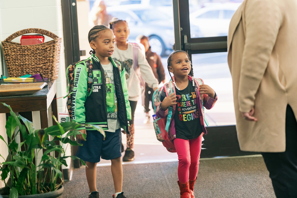 students walking into school