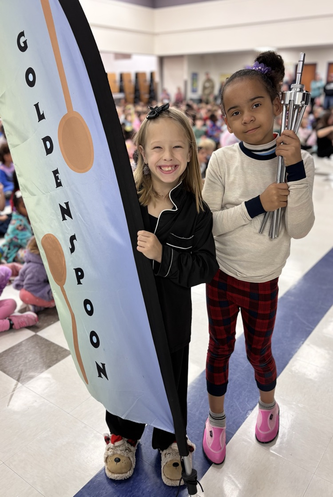 students with golden spoon flag 