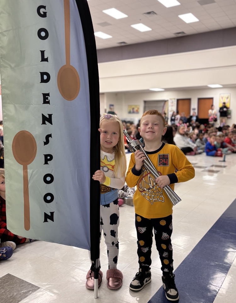 students with golden spoon flag 