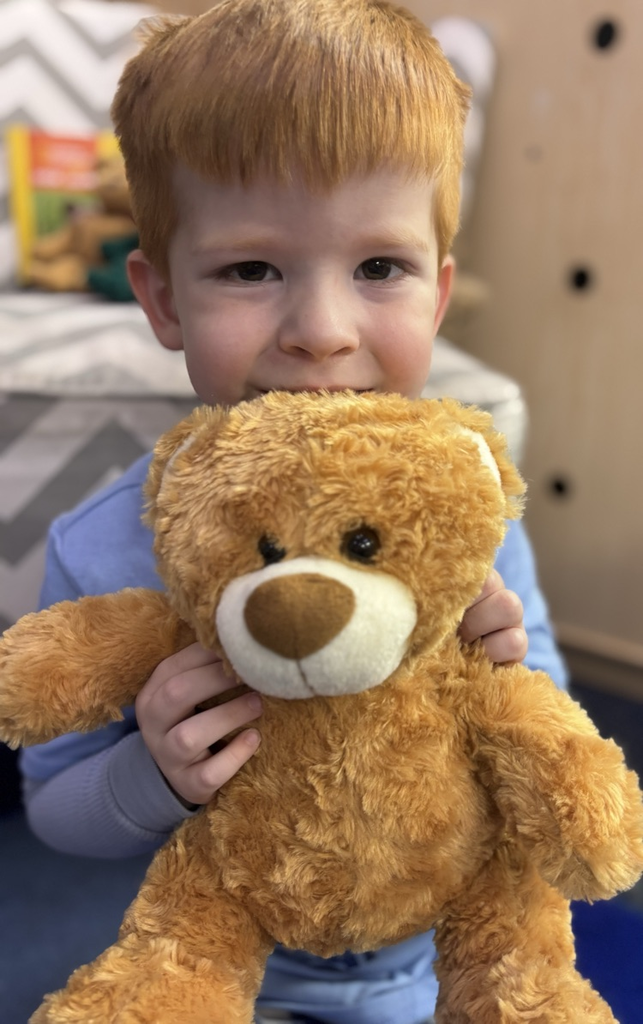 student with teddy bear 