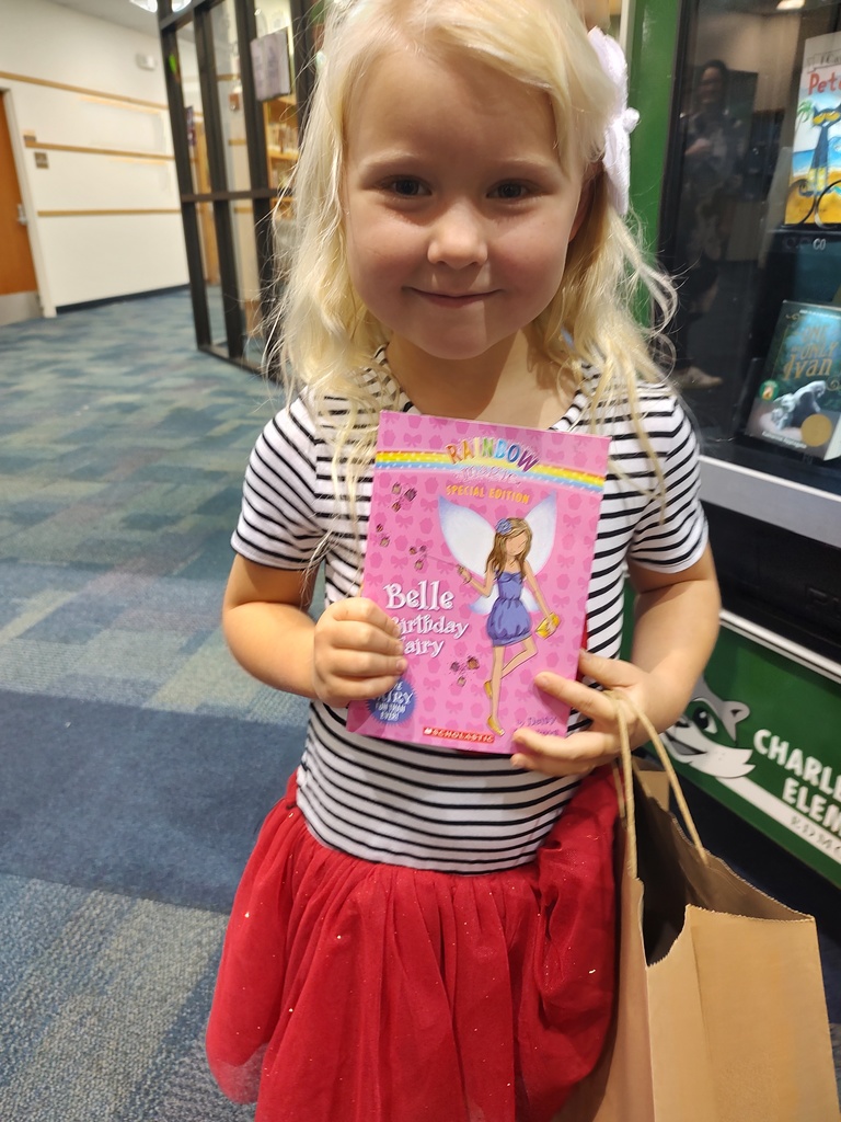 Student chooses book from vending machine