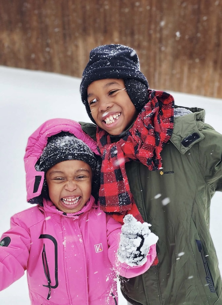 students smiling in the snow