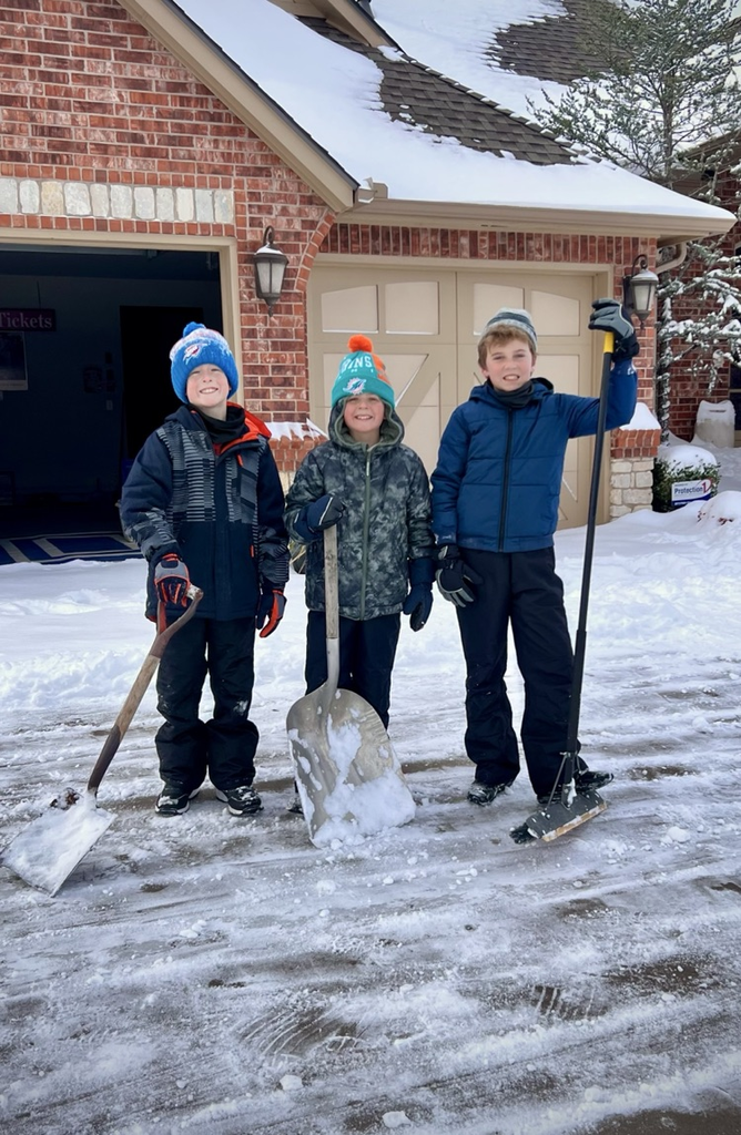 students shoveling the snow