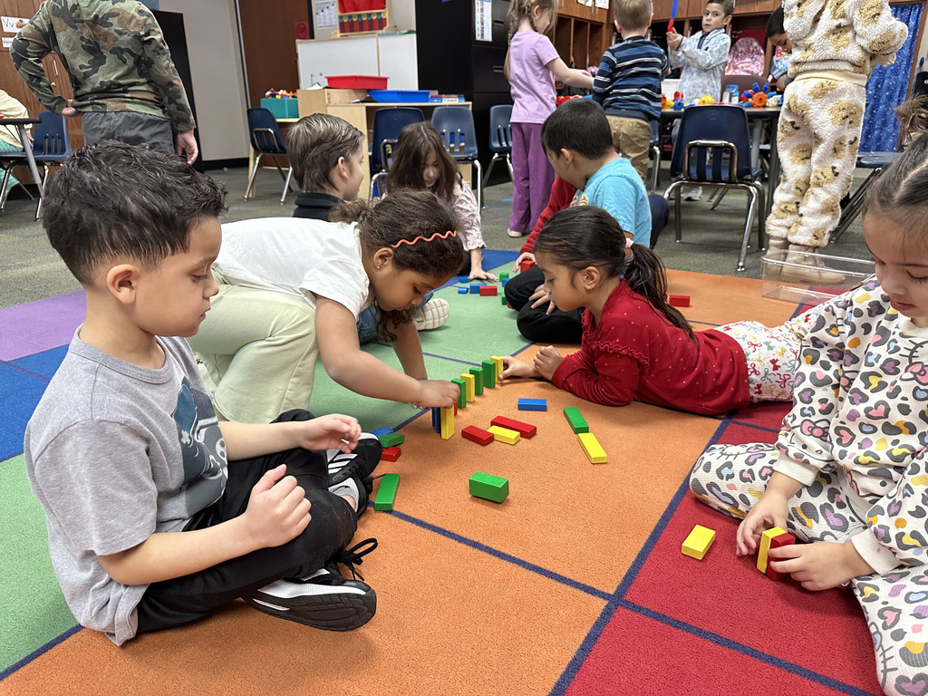 Students playing with dominos