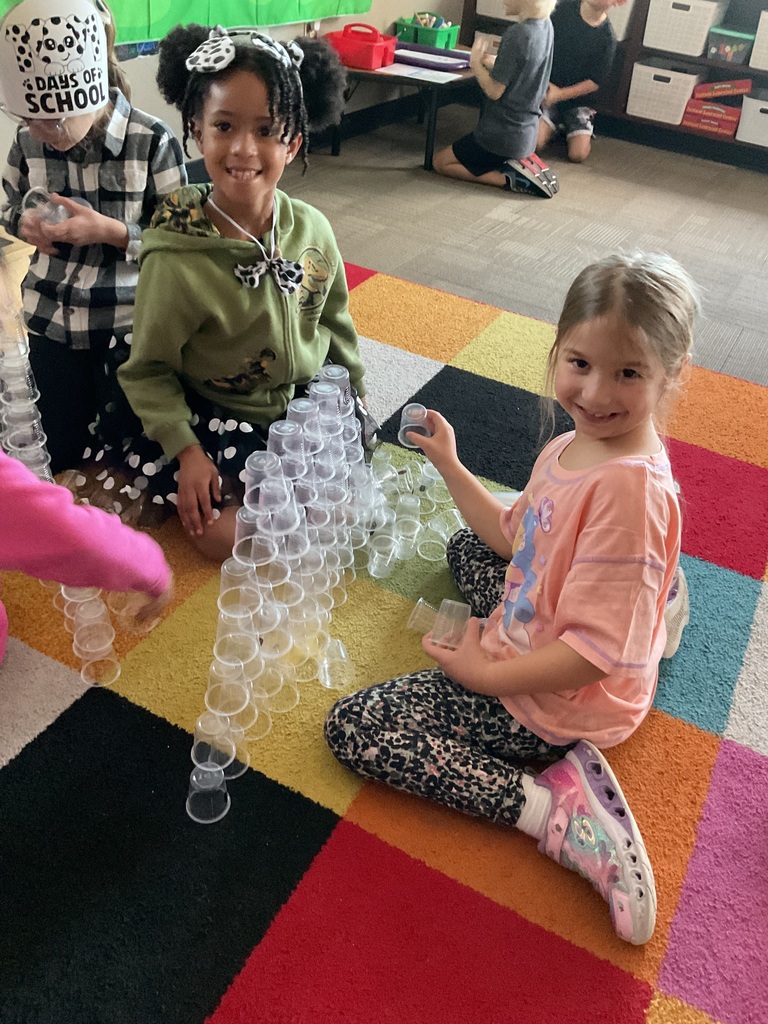 Students working on 101st day cup stacking