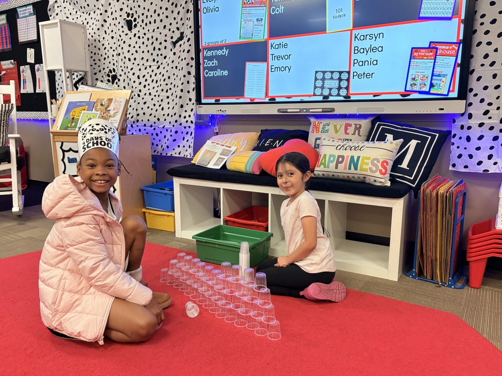 Students working on 101st day cup stacking