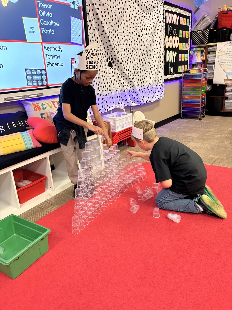 Students working on 101st day cup stacking