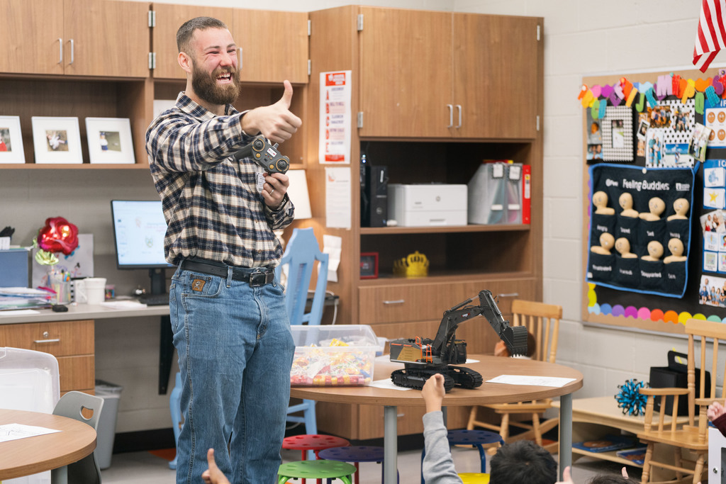 guest speaker giving a thumbs up