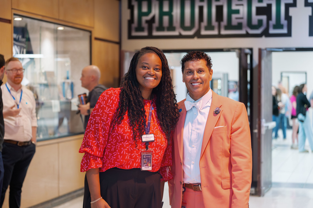 adults standing together smiling