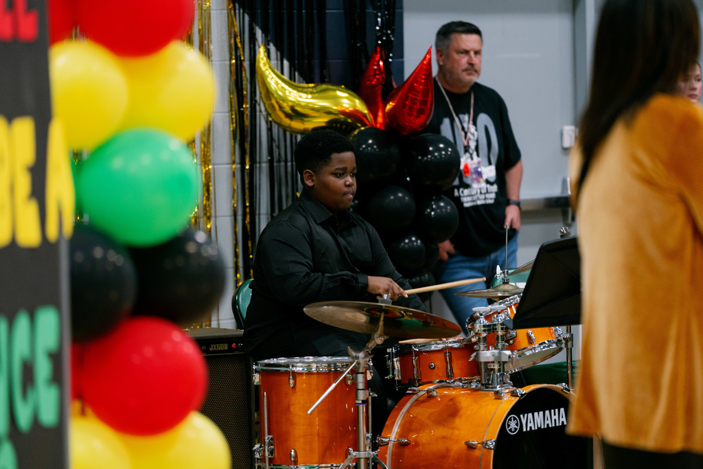 boy playing drums