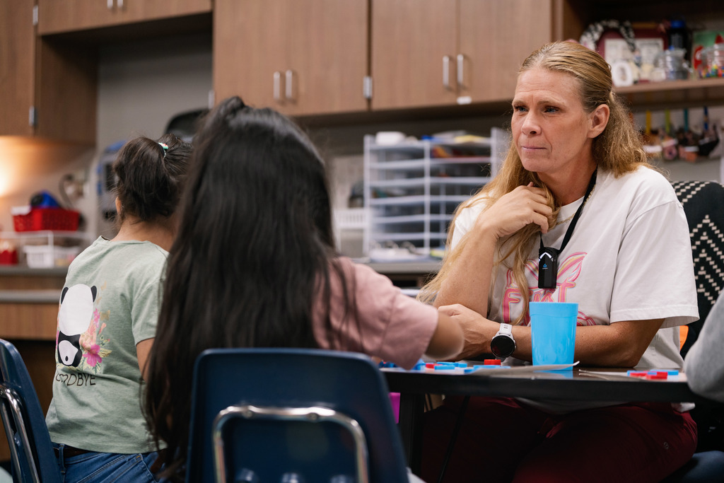 teacher talking to students