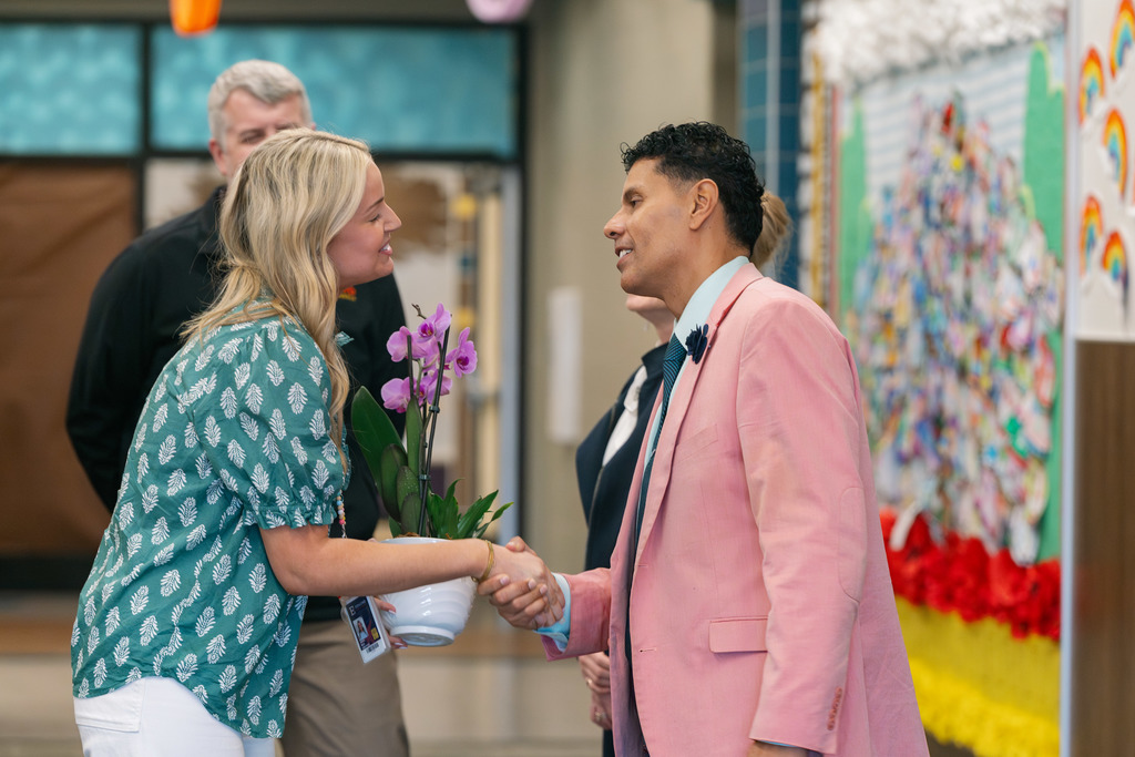 emma shaking dr. delich's hand