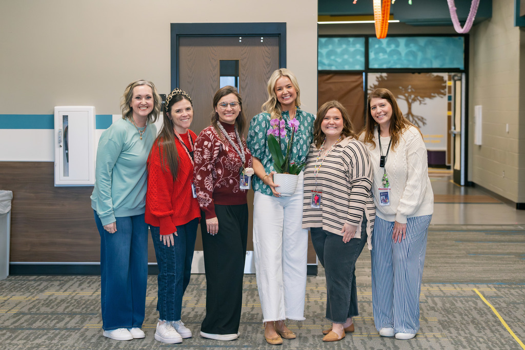 emma standing with her team