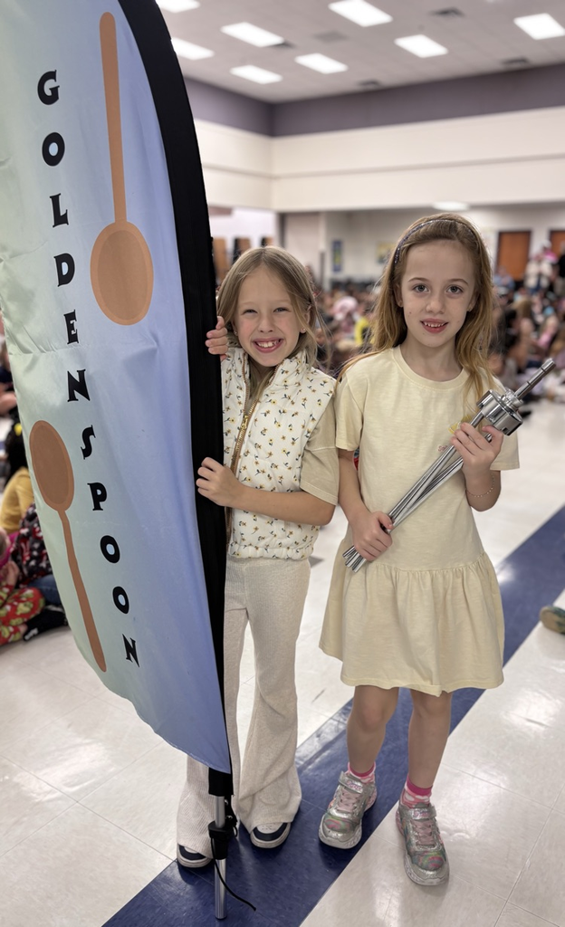 students with golden spoon flag 
