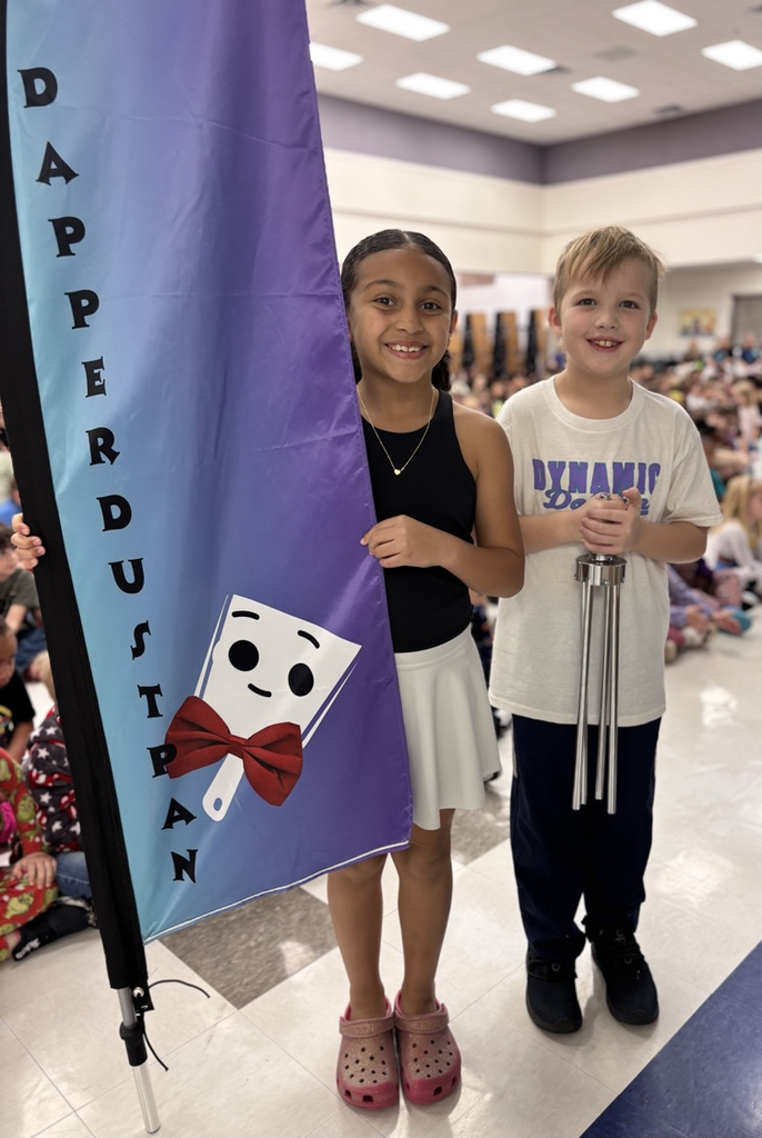 students with dapper dustpan flag 