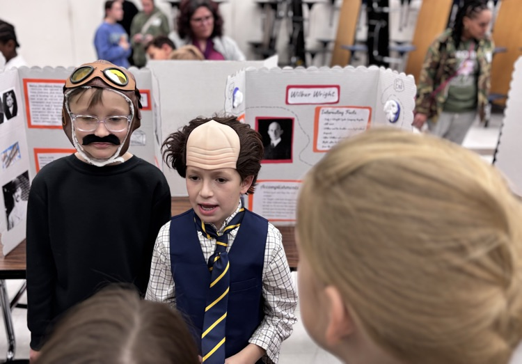 students presenting as the wright brothers 