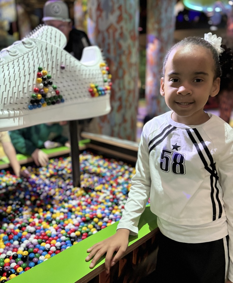 student exploring beading at FAM 