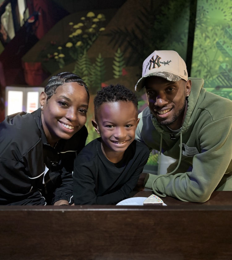 student with parents at FAM 