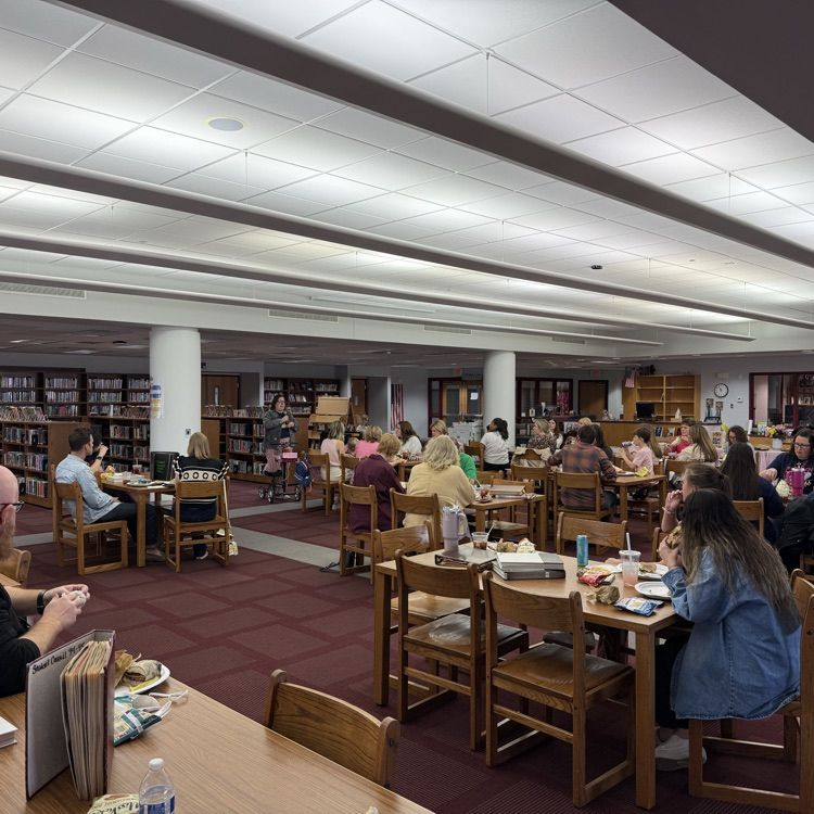 alumni eat lunch while Bekah Joash speaks 