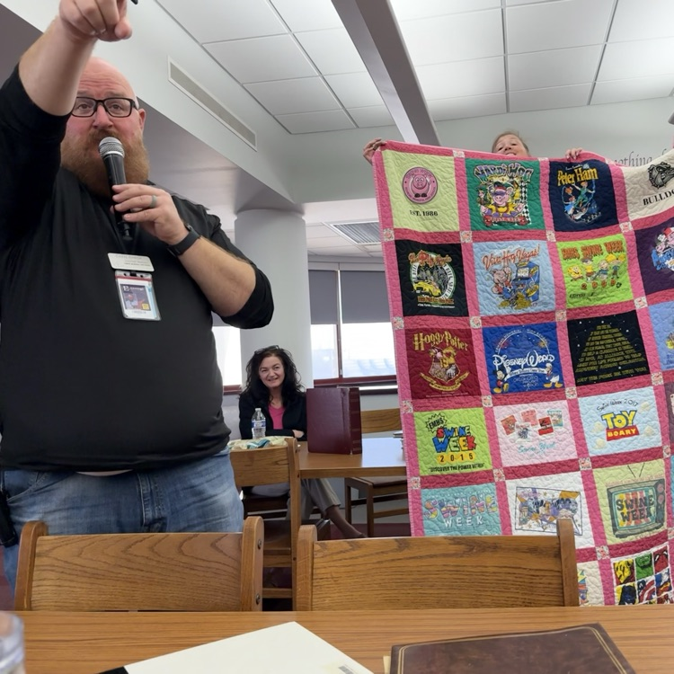 Evan Chada auctioning off the quilt 