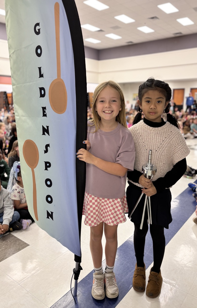 students with golden spoon flag 