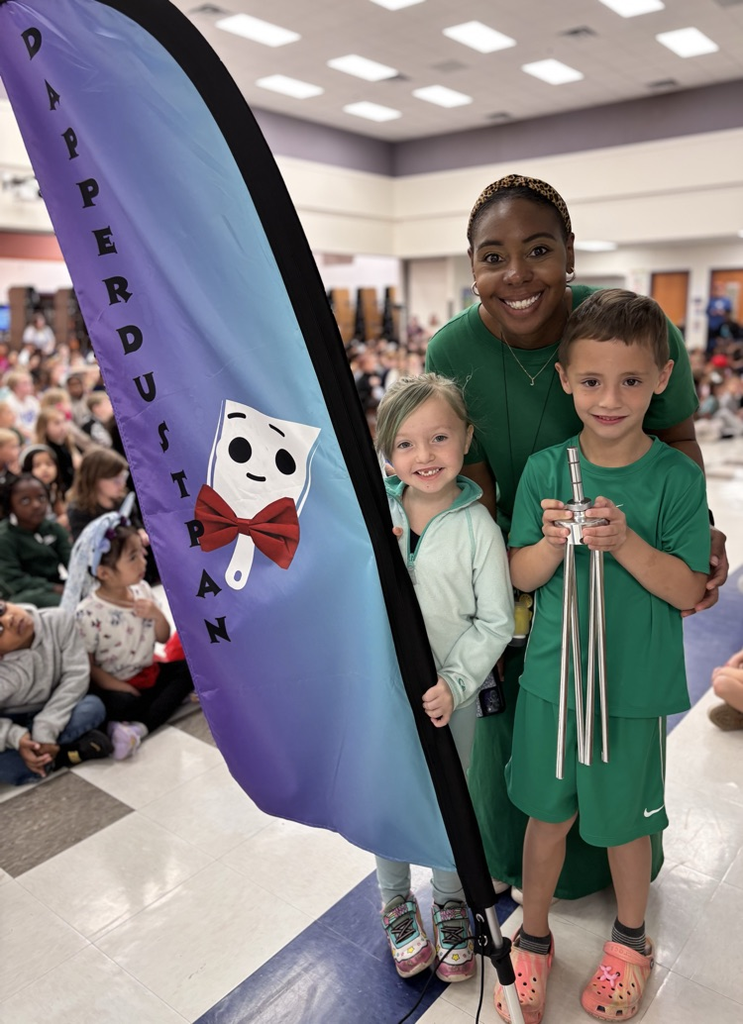 students with dapper dustpan flag 