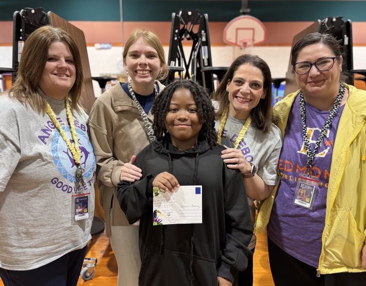student receiving postcard from teachers 
