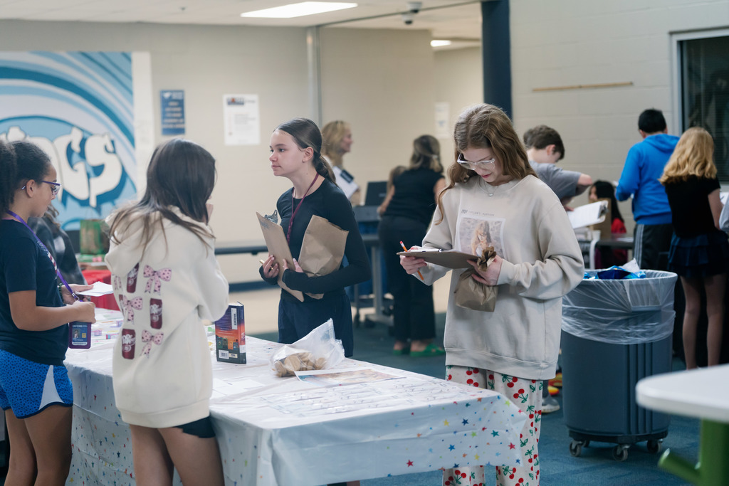student looking at clipboard