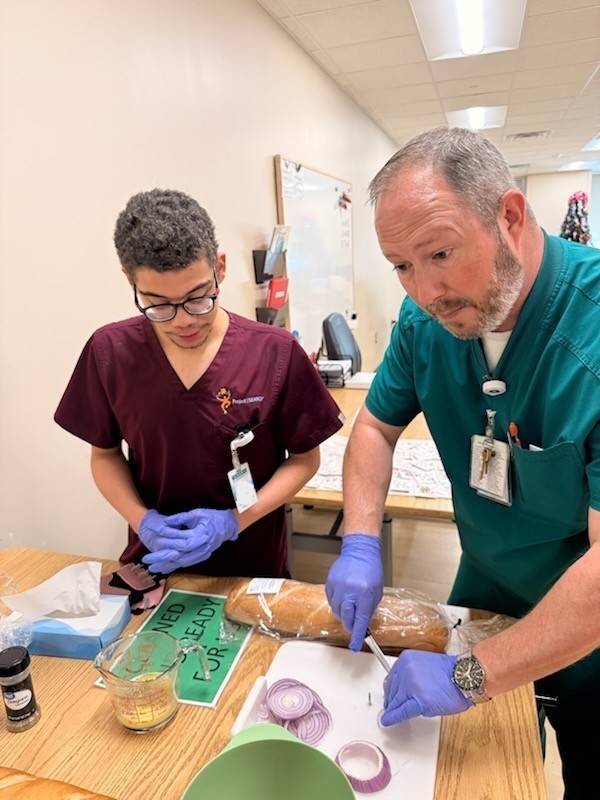 An intern assisting with cooking activities. 