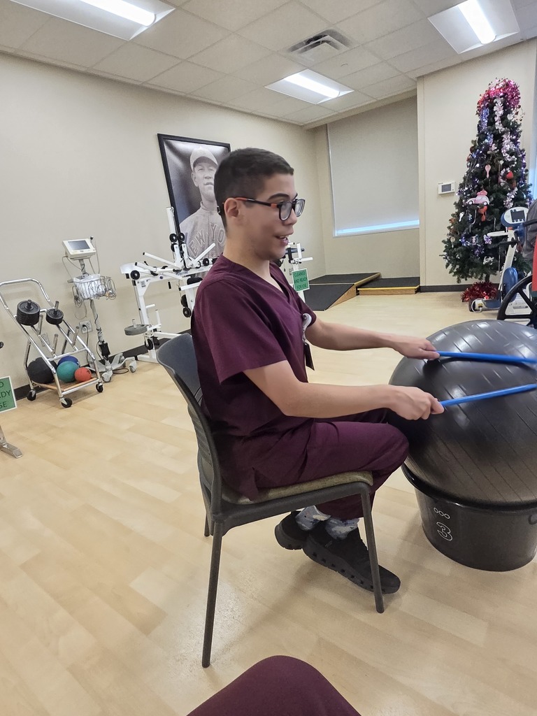 An intern assisting with music therapy. 