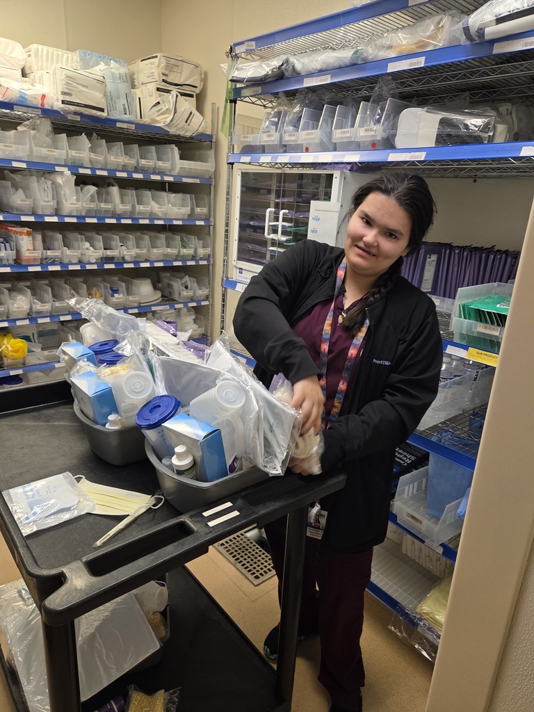 An intern stocking supplies.