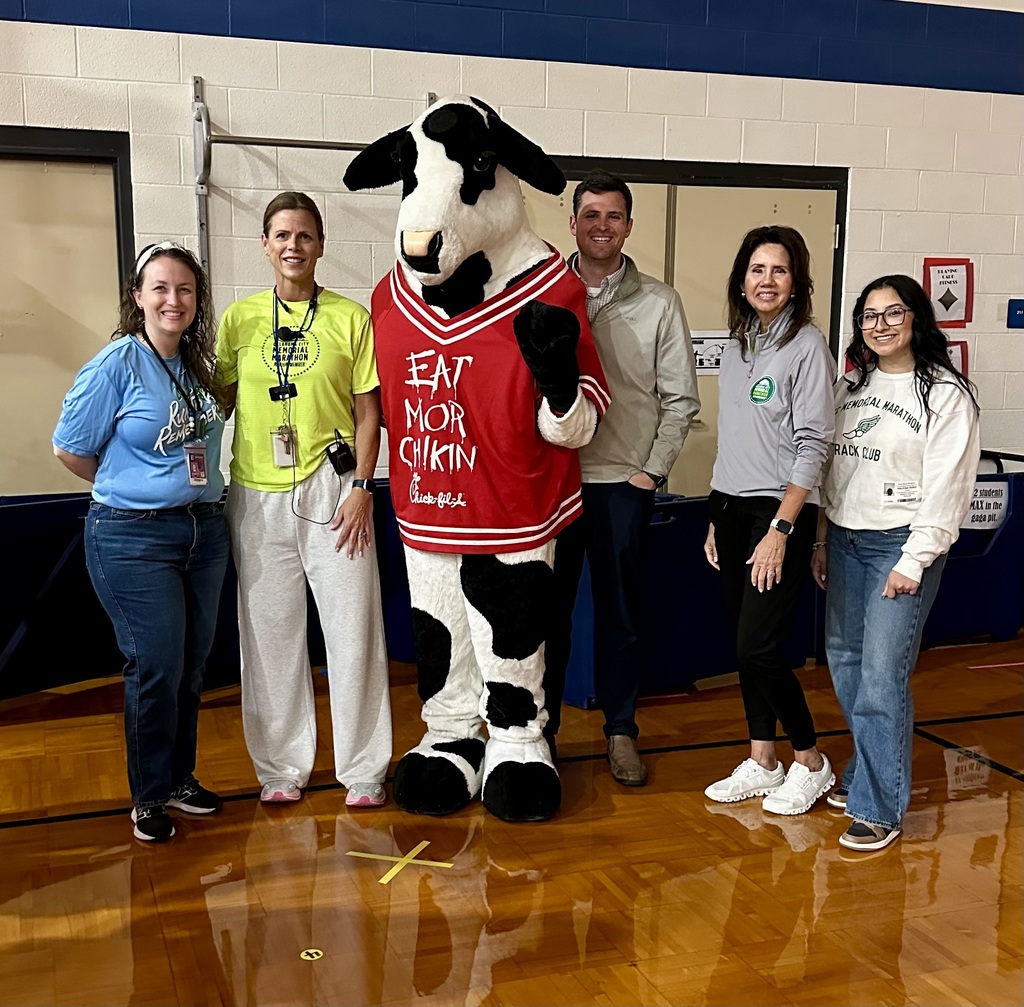 staff standing with the chick fil a cow