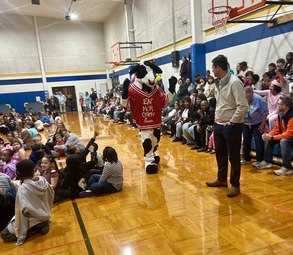 chick fil a cow walking in a gym