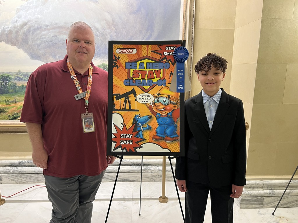 Jona Medina and Dwight Justice in front of the poster!