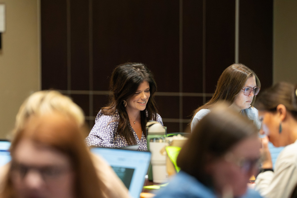 woman smiling at her computer